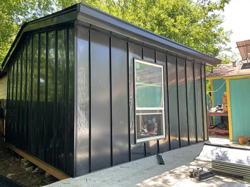 Black standing seam metal wall panels for Roof Inspection in St. Cloud